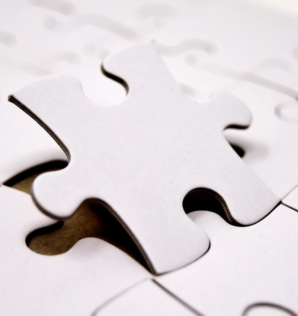 Close-up of interlocking white puzzle pieces representing integrated RFID solutions