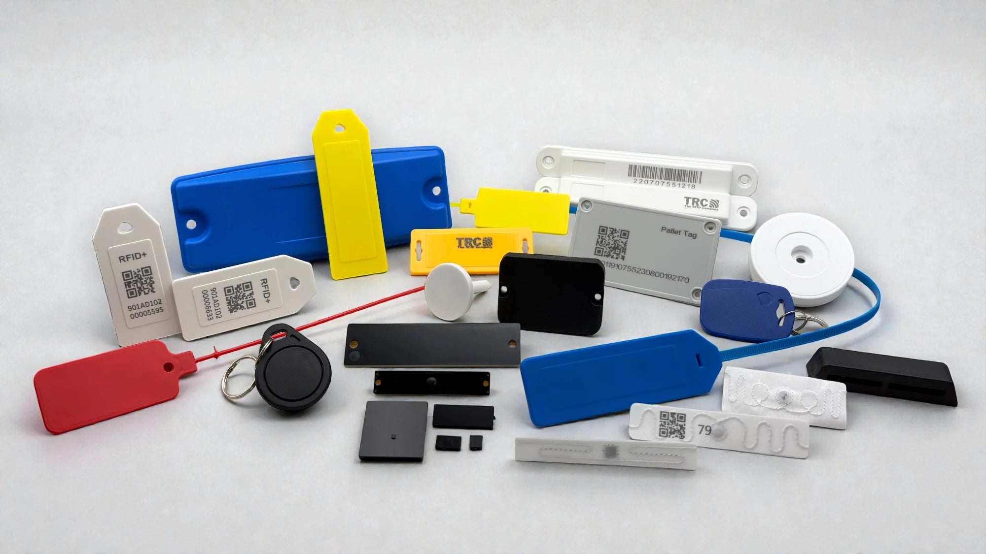 Collection of various TRC UHF RFID tags and NFC RFID Tags on a white background